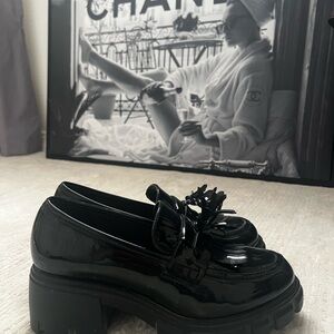 Glossy Black Loafers with Floral Accent